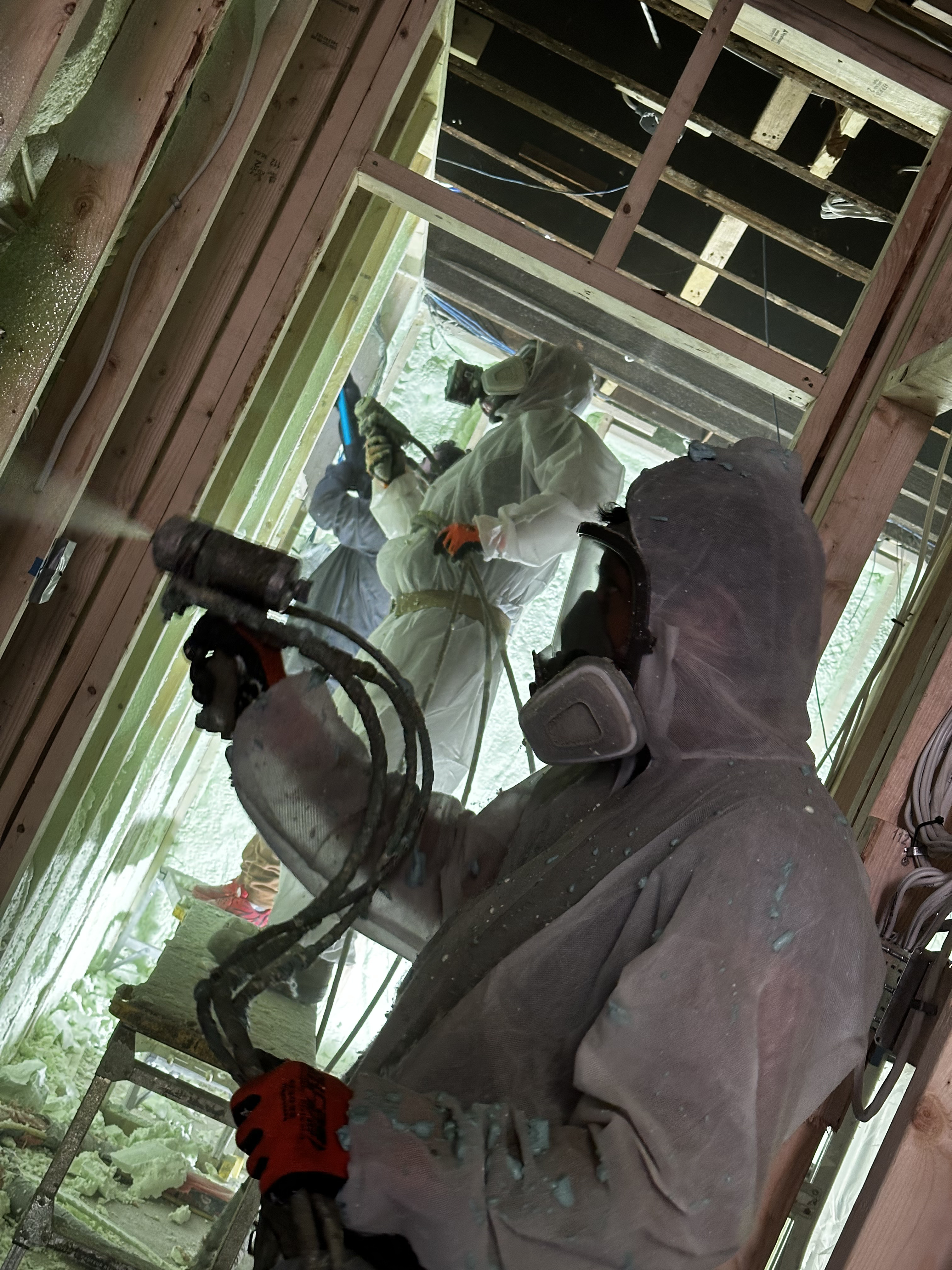 Spray foam installer at work